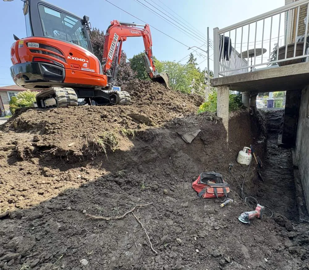 Réparation de fissures de fondation, installation de drain français et remplacement de dalle de béton